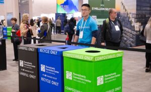 Clearly labelled recycling bins at an event.