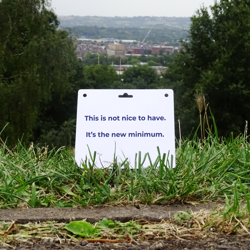 Badge with branding on a hill with a view